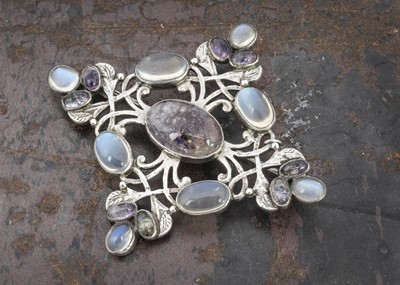 Lot 67 - An Arts and Crafts amethyst and moonstone lozenge shaped brooch
