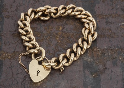 Lot 89 - A heavy 9ct gold curb link padlock bracelet