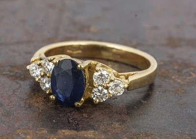 Lot 102 - A continental yellow metal sapphire and diamond dress ring