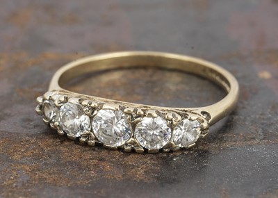 Lot 128 - A 9ct gold five stone dress ring