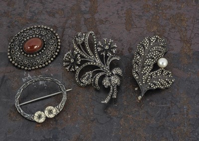 Lot 145 - A collection of four silver brooches