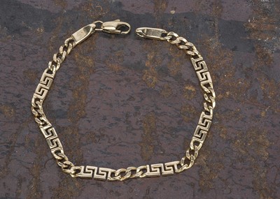 Lot 163 - A Continental 14K Greek Key and curb link bracelet