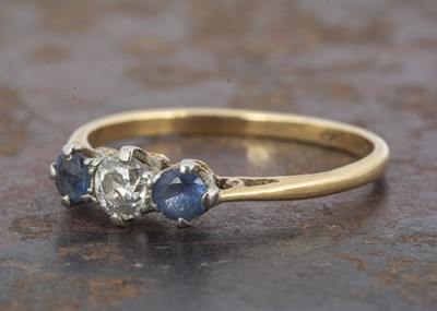 Lot 167 - A three stone diamond and sapphire ring
