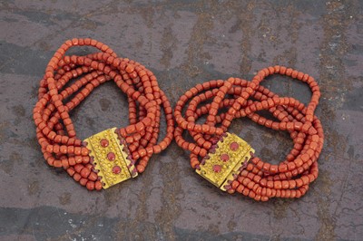 Lot 182 - A pair of 19th Century Italian coral six string bead bracelets
