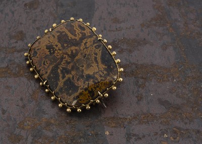 Lot 215 - A 19th century moss agate and gold framed brooch