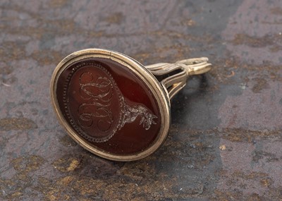 Lot 226 - A 19th century carnelian and yellow metal fob seal