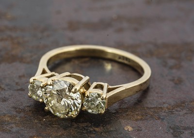 Lot 228 - An 18ct gold three stone diamond ring