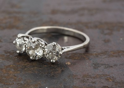 Lot 234 - A three stone old cut diamond ring