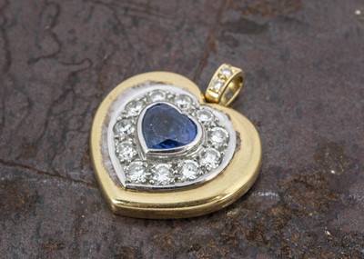 Lot 246 - An 18ct two colour gold sapphire and diamond heart shaped pendant