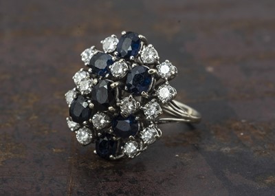 Lot 248 - A n 18ct gold sapphire and diamond cluster dress ring