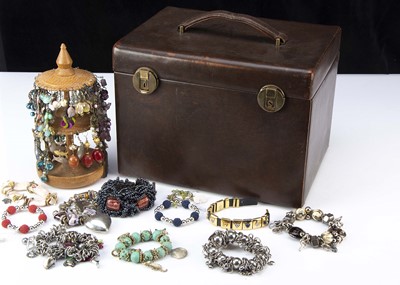 Lot 253 - A large brown leather travelling dressing table case