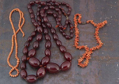 Lot 262 - A string of graduated 'cherry amber' double row of beads