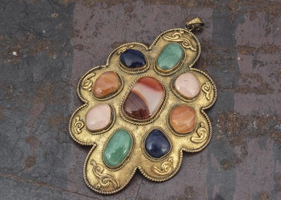 Lot 269 - A gilt metal shaped pendant