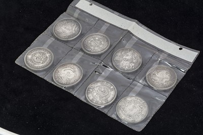 Lot 345 - A collection of eight Silver Chinese dollar style coins