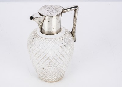 Lot 452 - A George V silver mounted cut glass claret jug