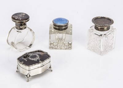 Lot 469 - An Edwardian silver and tortoiseshell trinket box and three glass and silver mounted bottles