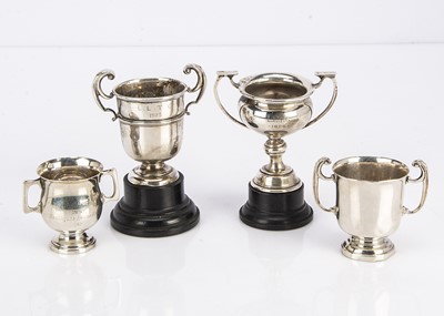 Lot 492 - Four first half 20th century miniature silver trophy cups