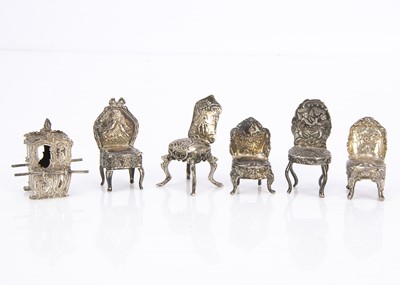 Lot 537 - A group of four Edwardian period silver miniature dining chairs