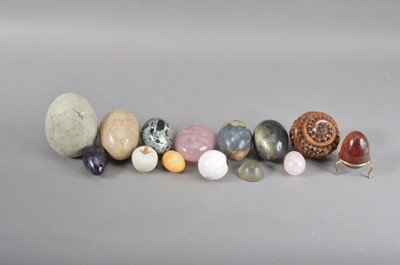 Lot 203 - A collection of carved hardstone eggs