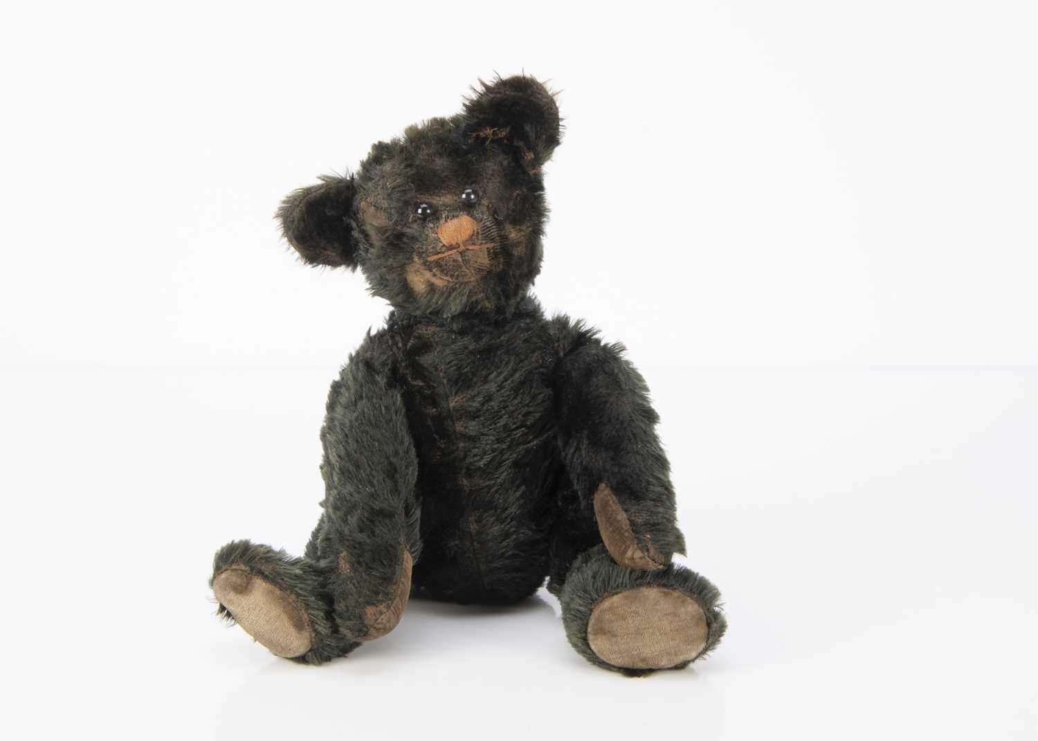 Lot 129 - A rare and unusual early black mohair teddy bear 1915-20