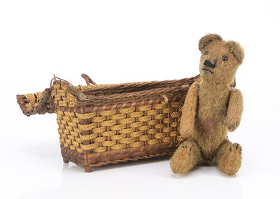 Lot 258 - A teddy bear in a basket 1910-20