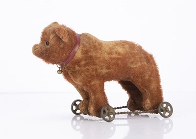 Lot 325 - A small German cinnamon mohair bear on wheels circa 1910
