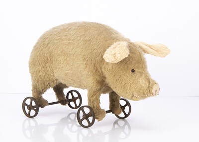 Lot 330 - An early German mohair pig on wheels 1910-20s