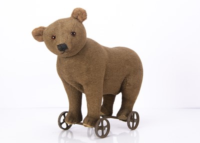 Lot 333 - An early Steiff centre-seam bear on wheels 1905-10