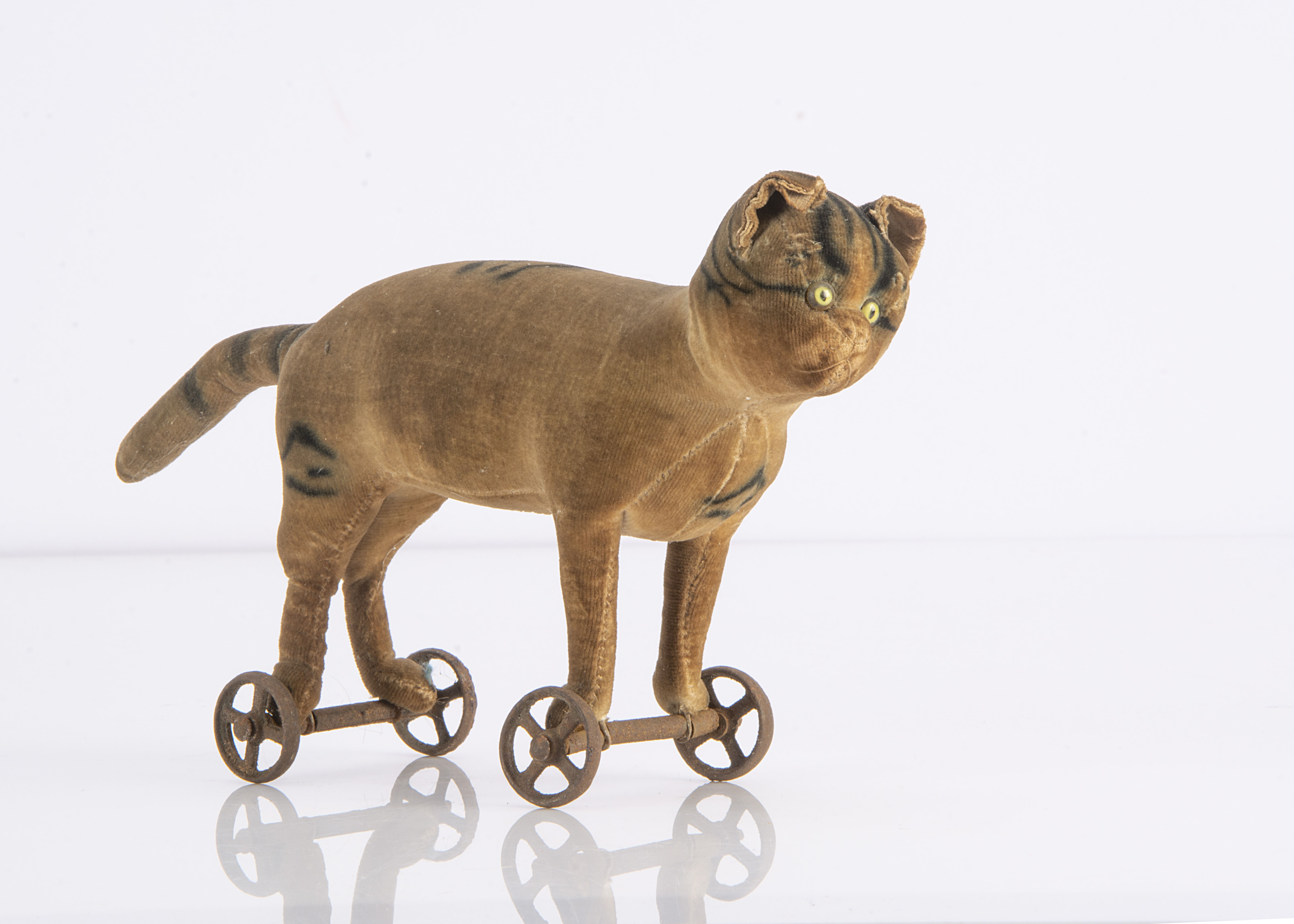 A rare early Steiff velvet cat on wheels