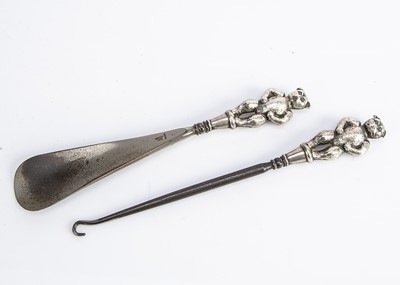 Lot 344 - A silver teddy bear button hook and shoe horn