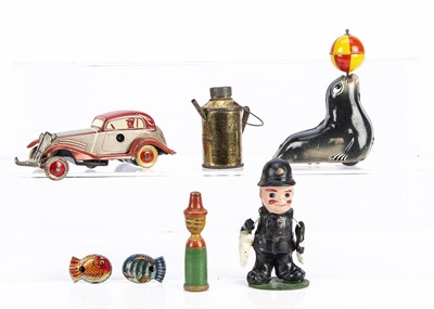 Lot 371 - A small German clockwork Penny Toy size saloon car