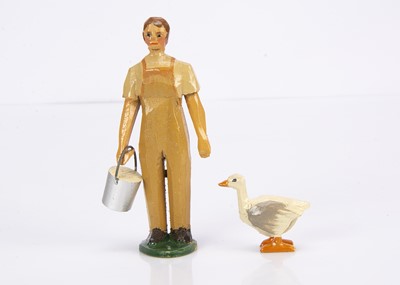 Lot 405 - A Forest Toys of Brockenhurst land girl with bucket and goose