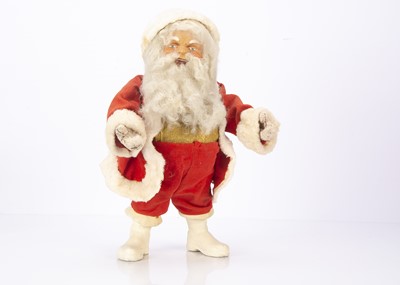 Lot 467 - A post-war German clockwork shop window nodding Father Christmas