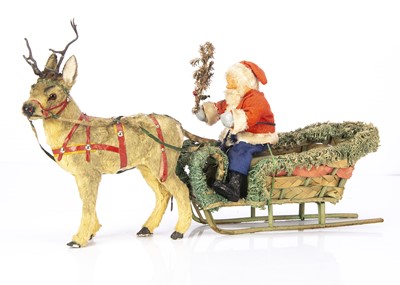 Lot 468 - A post-war German Father Christmas sleigh candy or cracker holder