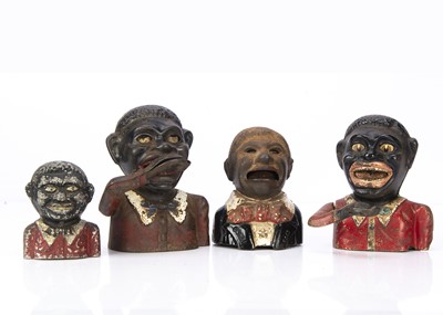 Lot 477 - Four cast-metal black men money banks