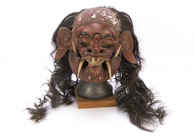 Lot 605 - A Balinese carved and painted wood Rangda mask