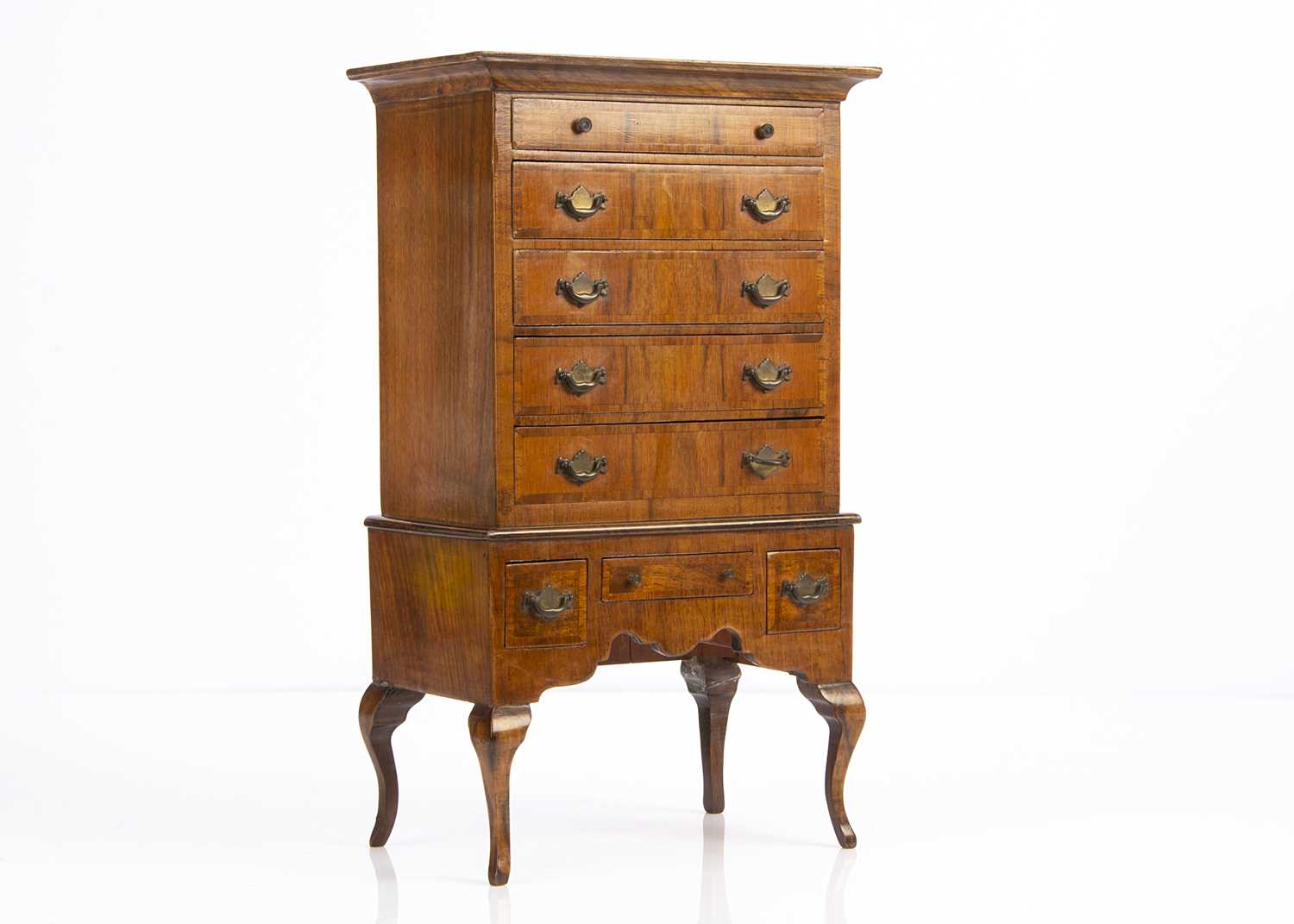Lot 678 - A 20th century walnut chest of drawers on stand