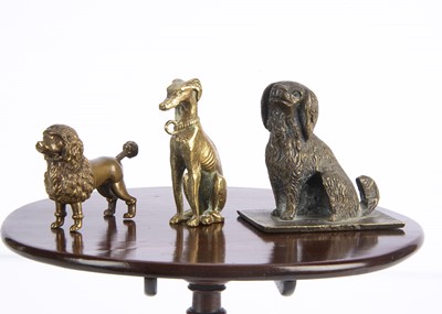 Lot 685 - A novelty brass poodle with tail mechanism