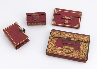 Lot 695 - Four 19th century gilt tooled red Morrocan leather sewing cases