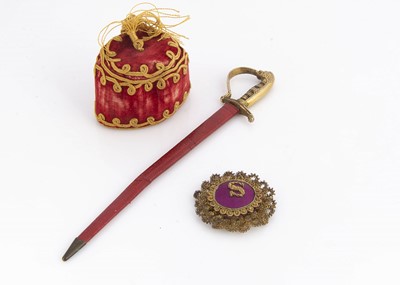 Lot 711 - A 19th century red velvet fez pen wipe