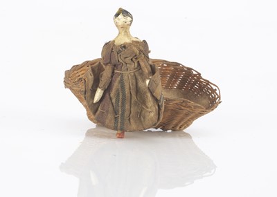 Lot 757 - A tiny mid 19th century dolls’ house Grodnerthal wooden doll