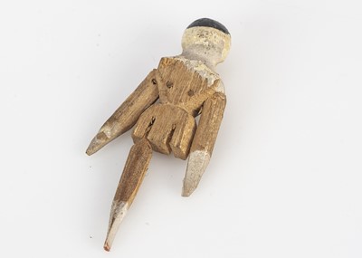 Lot 758 - A tiny late 19th century dolls’ house Grodnerthal wooden doll