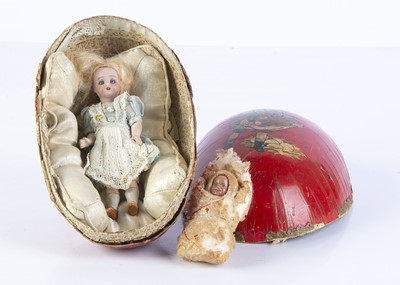 Lot 801 - A German bisque headed dolls’ house doll in Easter egg
