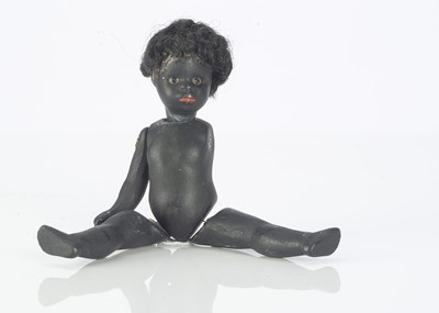 Lot 809 - An all-bisque black dolls’ house doll