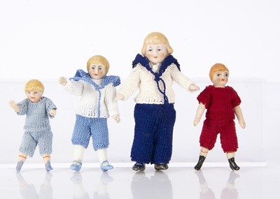 Lot 810 - Four all-bisque dolls’ house boy dolls