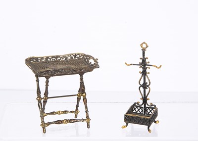 Lot 830 - Two late 19th century German soft metal dolls’ house items