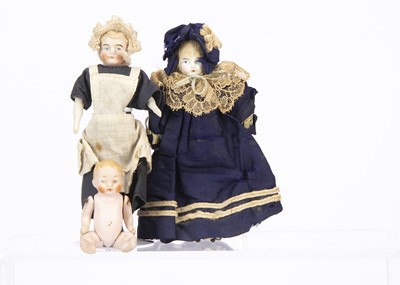 Lot 839 - Three dolls’ house dolls