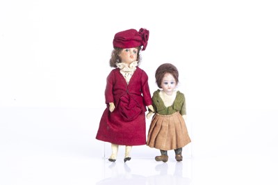 Lot 879 - Two bisque headed dolls’ house dolls