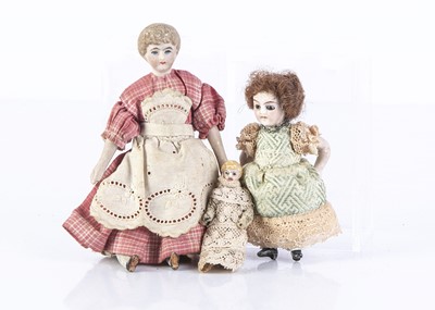 Lot 887 - Three dolls’ house dolls