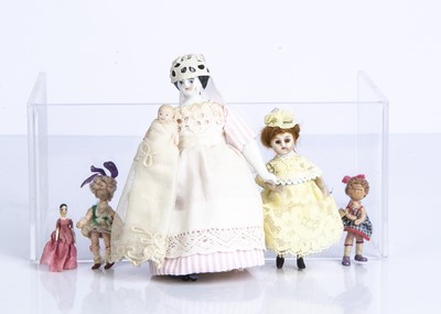 Lot 888 - Five dolls’ house dolls